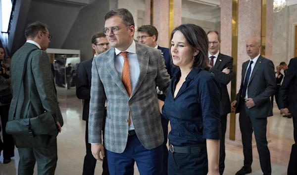 German Foreign Minister Annalena Baerbock, right, and Ukrainian Foreign Minister Dmytro Kuleba seen before joint news conference following their talks in Kiev, Ukraine, Monday, Sept. 11, 2022 (AP Photo/Efrem Lukatsky/Pool)