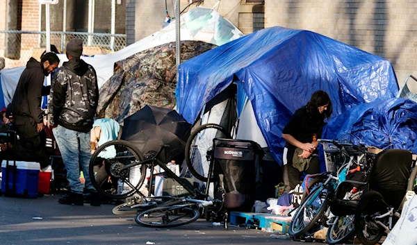 Tents of a homeless camp line the sidewalk in Boston, Saturday, Oct. 23, 2021 (AP)