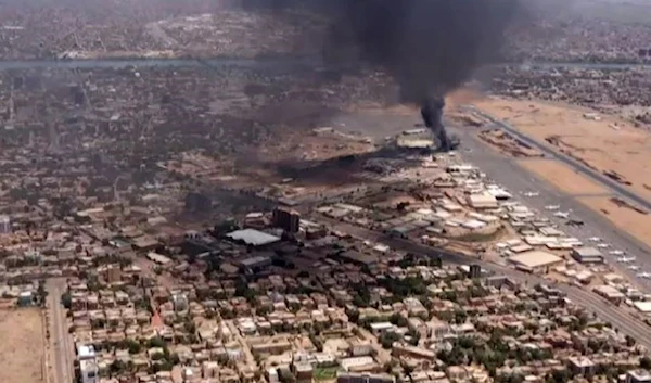 An aerial view shows black smoke rising above the Khartoum International Airport in Khartoum, Sudan, on April 20, 2023. (AFP via Getty Images)