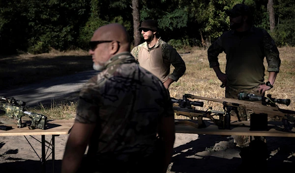 A member of the State Border Guard of Ukraine waits to show weapons to US Secretary of State Antony Blinken, September 7, 2023, in the Kiev Oblast, Ukraine (AP)