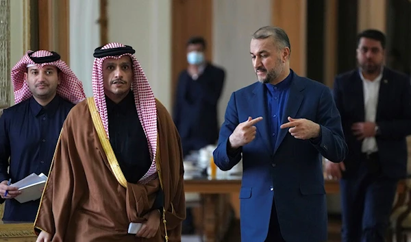 Iranian Foreign Minister Hossein Amirabdollahian, speaks with his Qatari counterpart Sheikh Mohammed bin Abdulrahman Al Thani as they arrive for a joint press briefing, in Tehran, Iran, Sunday, Jan. 29, 2023 (AP Photo/Vahid Salemi)