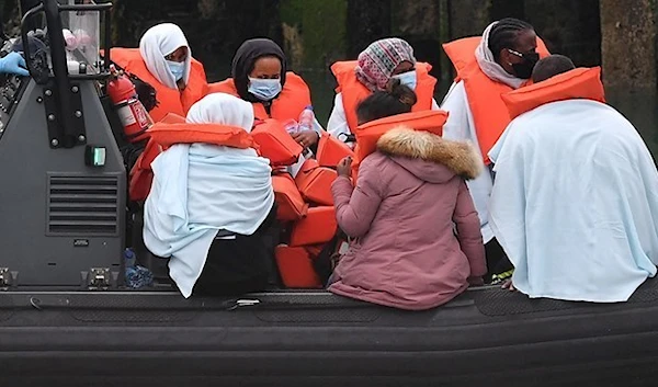 Migrants picked up at sea whilst Crossing the English Channel, but intercepted by UK Border Force officials, and taken into Dover. (AFP)