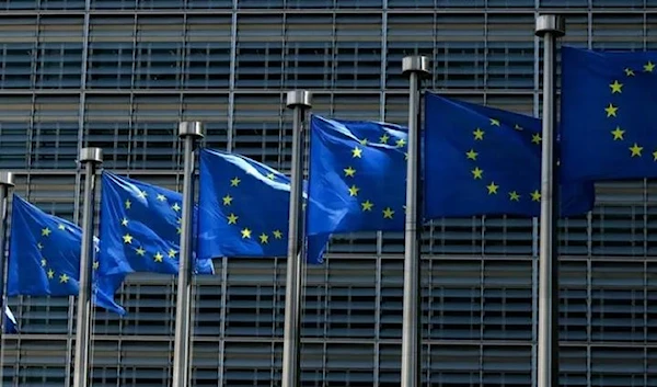 European Union flags fly outside the European Commission building in Brussel on June 16, 2022. (AFP)