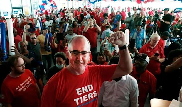 Shawn Fain, the UAW president, with workers in Warren, Michigan in August. (AFP/Getty Images)