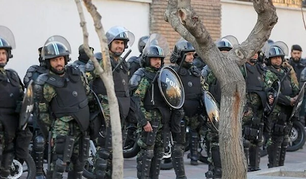 Iranian security forces stand guard in the capital Tehran on January 12, 2020. (AFP)