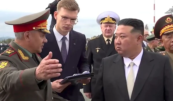 In this image taken from video released by Russian Defense Ministry Press Service on Saturday, Sept. 16, 2023, DPRK’s leader listens to Russian Defense Minister as he inspects Russian warplanes in Vladivostok. (AP)