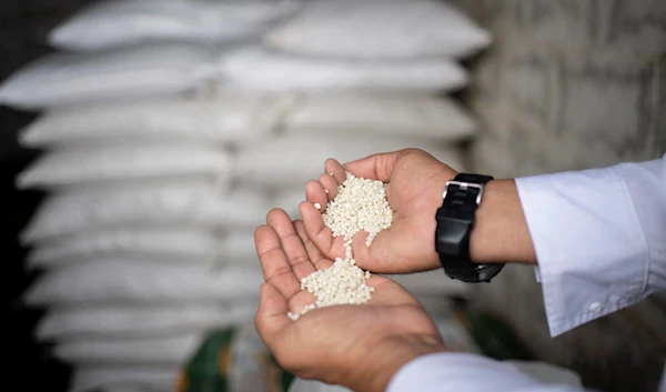 A Venezuelan farmer in the western town of Turen shows some imported Russian fertilizer (AFP)