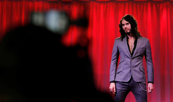 A photographer takes a photo of the new waxwork figure of Russell Brand as it is unveiled at Madame Tussaud's on Monday, Oct. 11, 2010, in north London. (AP)