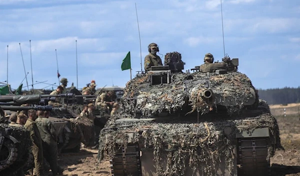 German Bundeswehr soldiers of the NATO enhanced forward presence battalion on the Germany army Main battle tanks Leopard 2A6 at the Training Range in Pabrade, some 60km (38 miles) north of the capital Vilnius, Lithuania, May 30, 2023. (AP)