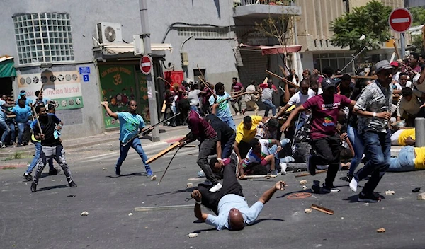 Israeli occupation police clash with Eritrean migrants, in “Tel Aviv”, Sept. 2, 2023 (AP)