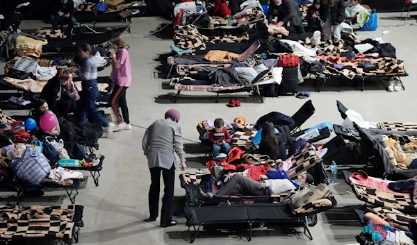 Refugees from the war in Ukraine seek shelter at a sports center in Warsaw, Poland, on March 11, 2022. (AP)