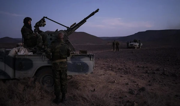 Polisario front soldiers talk during a shooting exercise near Mehaires, Western Sahara, October 13, 2021. (AP)