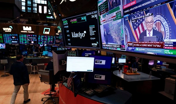 A press conference by Federal Reserve chairman Jerome Powell is displayed on the floor at the New York Stock Exchange in New York, Wednesday, Sept. 20, 2023 (AP Photo/Seth Wenig)