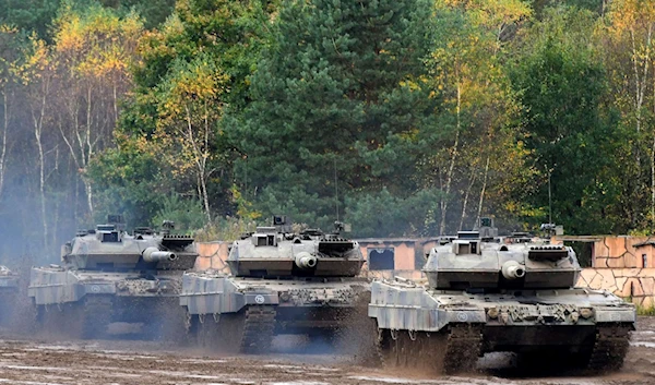 An armored unit with Leopard 2 A7 main battle tanks during educational practice at the military training area in Munster, Germany (AFP)