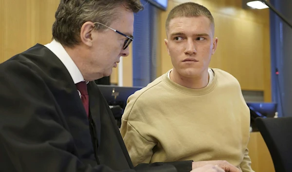 Ex-Wagner member Andrey Medvedev listens to his lawyer Brynjulf Risnes during a court hearing in Oslo, April 25, 2023. (AP)