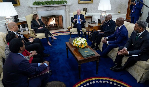 President Joe Biden and Vice President Kamala Harris meet with members of the Congressional Black Caucus in the Oval Office of the White House in Washington, D.C., Feb. 2, 2023. (AP)