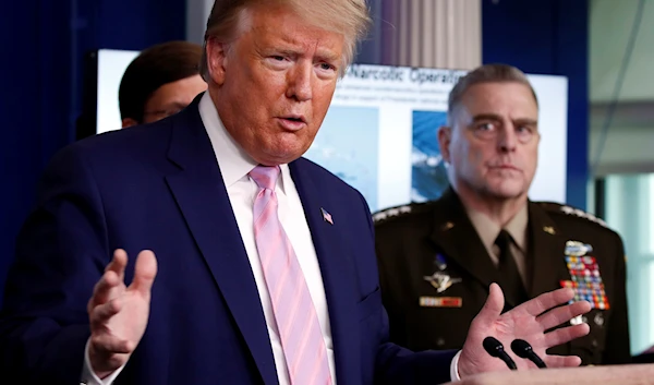 US President Donald Trump speaks in the James Brady Press Briefing Room of the White House, April 1, 2020, in Washington, as Chairman of the Joint Chiefs Gen. Mark Milley listens. (AP)