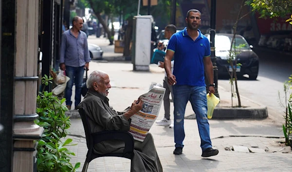 A man reads a newspaper in Cairo, Egypt, Sept. 8, 2022 (AP Photo/Amr Nabil)