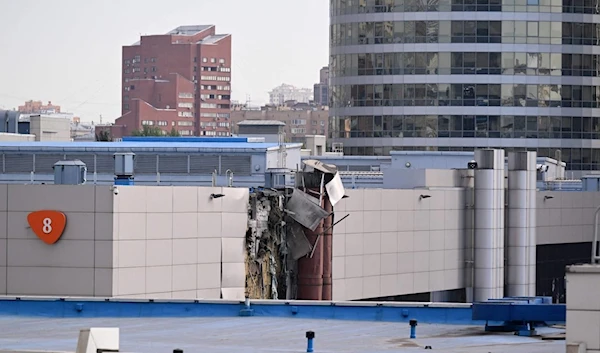 This photo shows damage on an Expo Center building following a drone attack in Moscow on August 18, 2023. (AFP)