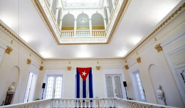 Cuban flag flutters inside the Cuban embassy in Washington (AP)