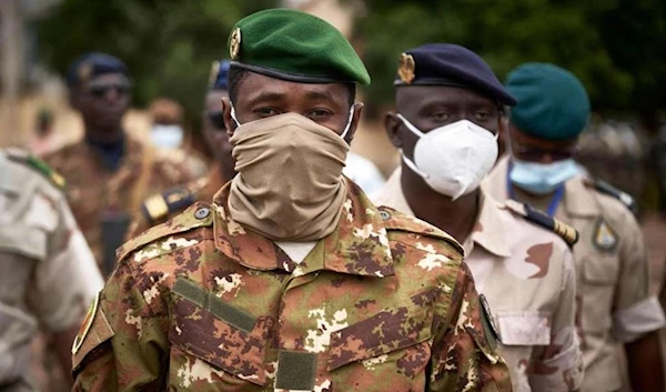 Mali junta leader Colonel Assimi Goita (centre) in Bamako on September 18, 2020. (AFP)