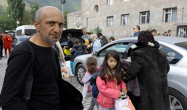 Ethnic Armenians from Nagorno-Karabakh arrive in Armenia's Goris, the town in Syunik region, Armenia, Monday, Sept. 25, 2023 (AP Photo/Vasily Krestyaninov)