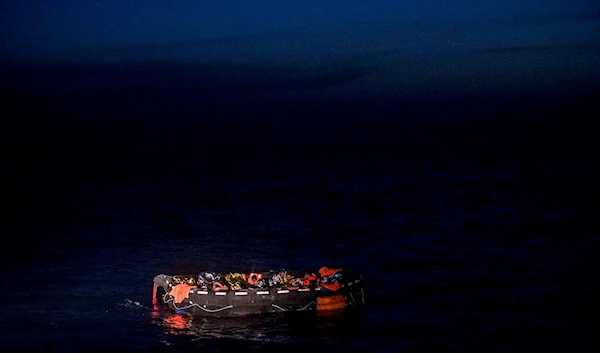 Migrants sit in a life raft off the waters of Tunisia early Wednesday, May 25, 2022 (AP)