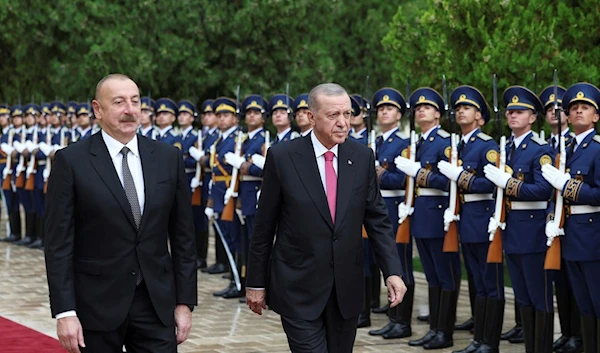 Azerbaijan's President Ilham Aliyev, left, and Turkey's President Recep Tayyip Erdogan review an honor guard during a welcome ceremony in Nakhchivan, Azerbaijan, Monday, Sept. 25, 2023. (AP)