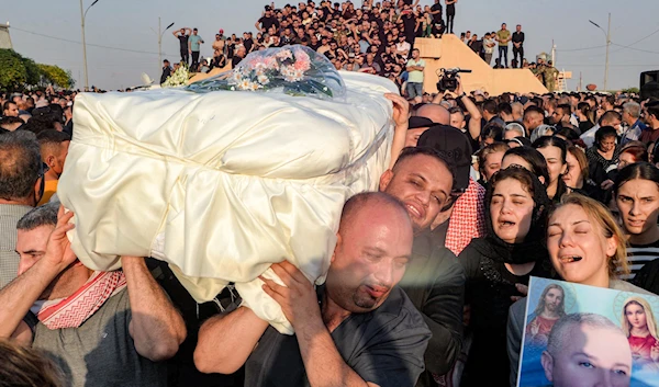 In tears, Iraqi town bids farewell to victims of tragic wedding fire