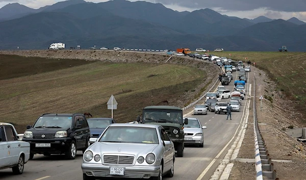 A convoy of cars of ethnic Armenians from Nagorno-Karabakh move to Kornidzor in Syunik region, Armenia, Sept. 26, 2023. (AP)