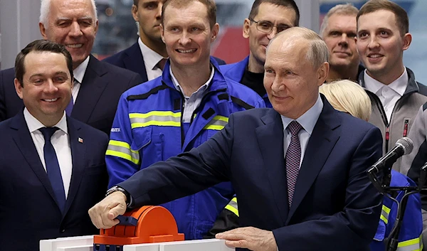 Russian President Vladimir Putin attends the launch ceremony for the first technological line for liquefying natural gas on gravity bases as part of the Arctic LNG2 project at the Center in Murmansk, Russia, July 20, 2023 (AP)