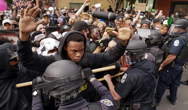 Police and protesters converge during a demonstration on September 23, 2020, in Louisville, Kentucky. (AP)