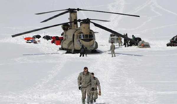 A helicopter from the 52nd Aviation Regiment lands on Kahiltna Glacier near Denali, Alaska (AP)