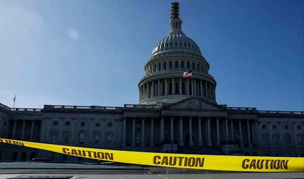 Caution tape blows in the wind on the east front plaza of the US Capitol on Sept 27, 2023 (AFP)