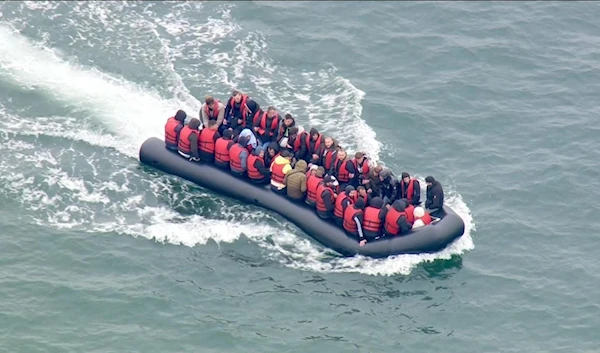 A group of migrants in a dinghy approach southern England after crossing the Channel from France on September 1, 2020. (AFP)