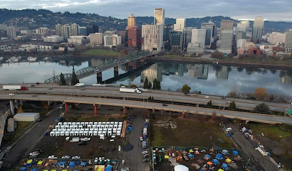 tents housing people experiencing homelessness are set up on a vacant parking lot in Portland, Ore., Dec. 8, 2020 (AP)