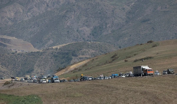 Ethnic Armenians from Nagorno-Karabakh drive their cars on the road from Nagorno-Karabakh to Armenia's Goris in Syunik region, Armenia, Friday, Sept. 29, 2023. (AP)