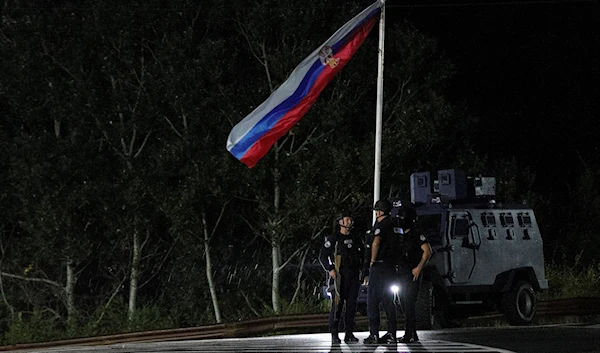 Kosovo police officers guard road near the village of Banjska, northern Kosovo, Sunday, Sept. 24, 2023. (AP)