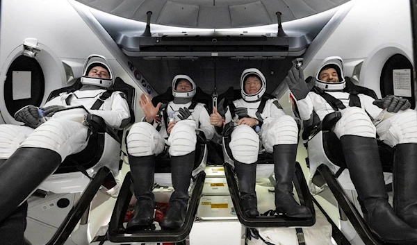 Sultan al-Neyadi are seen inside a SpaceX capsule onboard the SpaceX recovery ship MEGAN shortly after having landed in the Atlantic Ocean off the coast of Jacksonville, Florida, Monday, Sept. 4, 2023. (NASA via AP)