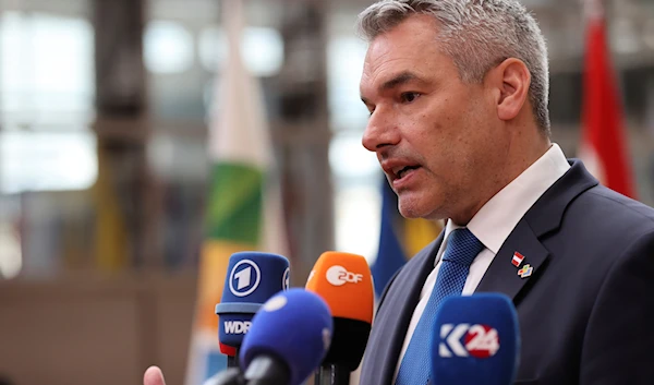 Austria's Chancellor Karl Nehammer speaks with the media as he arrives for the third EU-CELAC summit in Brussels, Belgium, July 17, 2023 (AP)