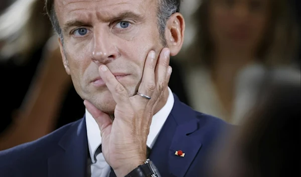 French President Emmanuel Macron listens to teachers during a visit to a vocational school in Orange, Southeastern France, Friday Sept. 1, 2023. (AP)