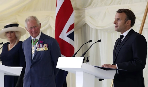 Britain's Prince Charles and Camilla look on as Emmanuel Macron, the French President as he makes a speech at Carlton Gardens in London, on June 18, 2020. (AP)