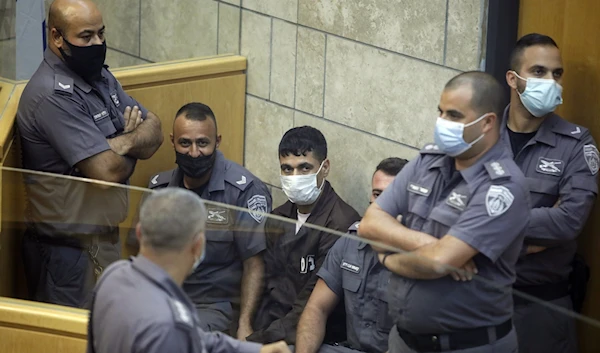 Operation Freedom Tunnel hero, prisoner Mahmoud Al-Aridah during his trial in occupied Palestine at the hands of the Israeli occupation