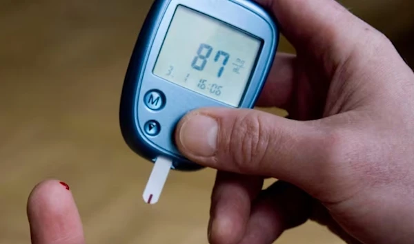 This Jan. 3, 2009 file photo shows a person with diabetes testing his blood sugar level in Kamen, Germany. (AP)