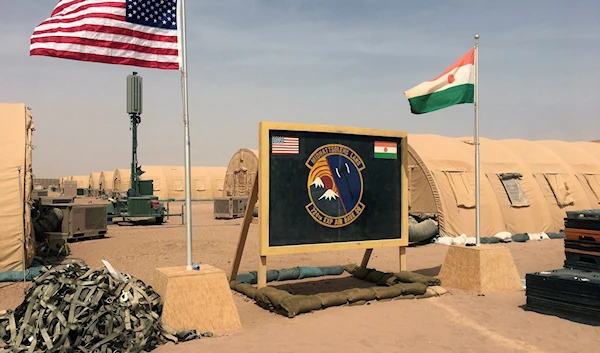 U.S. and Niger flag are raised side by side at the base camp for air forces and other personnel supporting the construction of Niger Air Base 201 in Agadez, Niger April 16, 2018 (AP)