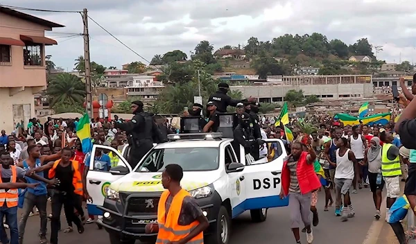 This video grab shows coup supporters cheering police officers in Libreville, Gabon, on Aug. 30, 2023 (AP Photo/Betiness Mackosso, File)