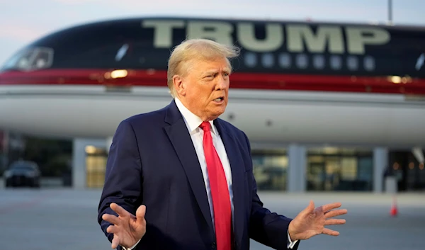 Former President Donald Trump speaks with reporters before departure from Hartsfield-Jackson Atlanta International Airport, Aug. 24, 2023 (AP)