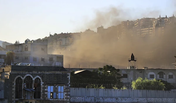 Smoke rises during clashes between members of Fatah and Islamist militants in the Ain al-Hilweh refugee camp, September 8, 2023 (AP)