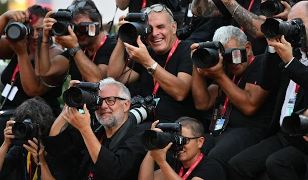 Photographers at Venice Immersive (AFP)