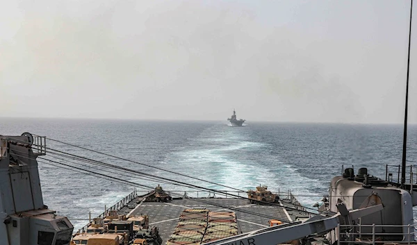 In this image provided by the U.S. Navy, the amphibious dock landing ship USS Carter Hall and amphibious assault ship USS Bataan transit the Bab al-Mandab strait on Aug. 9, 2023. (AP)